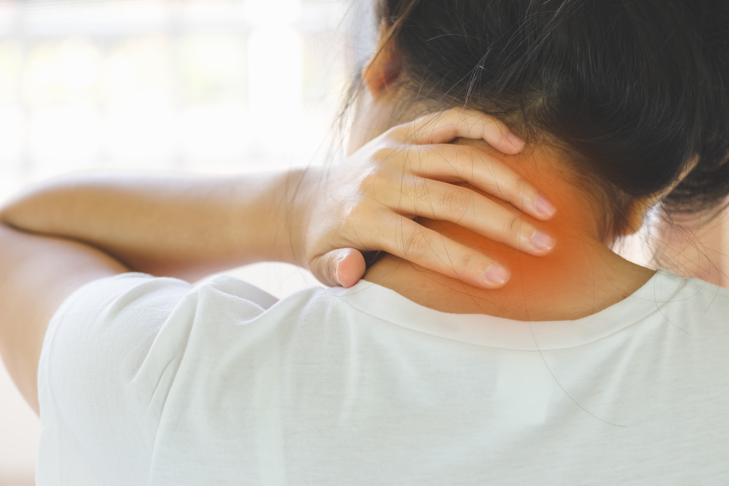 Closeup of Young Woman Suffering from Pain in Neck While Sitting on Bed at Home, People with Body-Muscles Problem, Healthcare and Medicine Concept